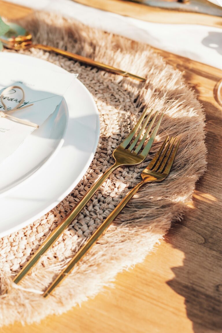An elegant place setting with a stainless steel fork on a white ceramic plate