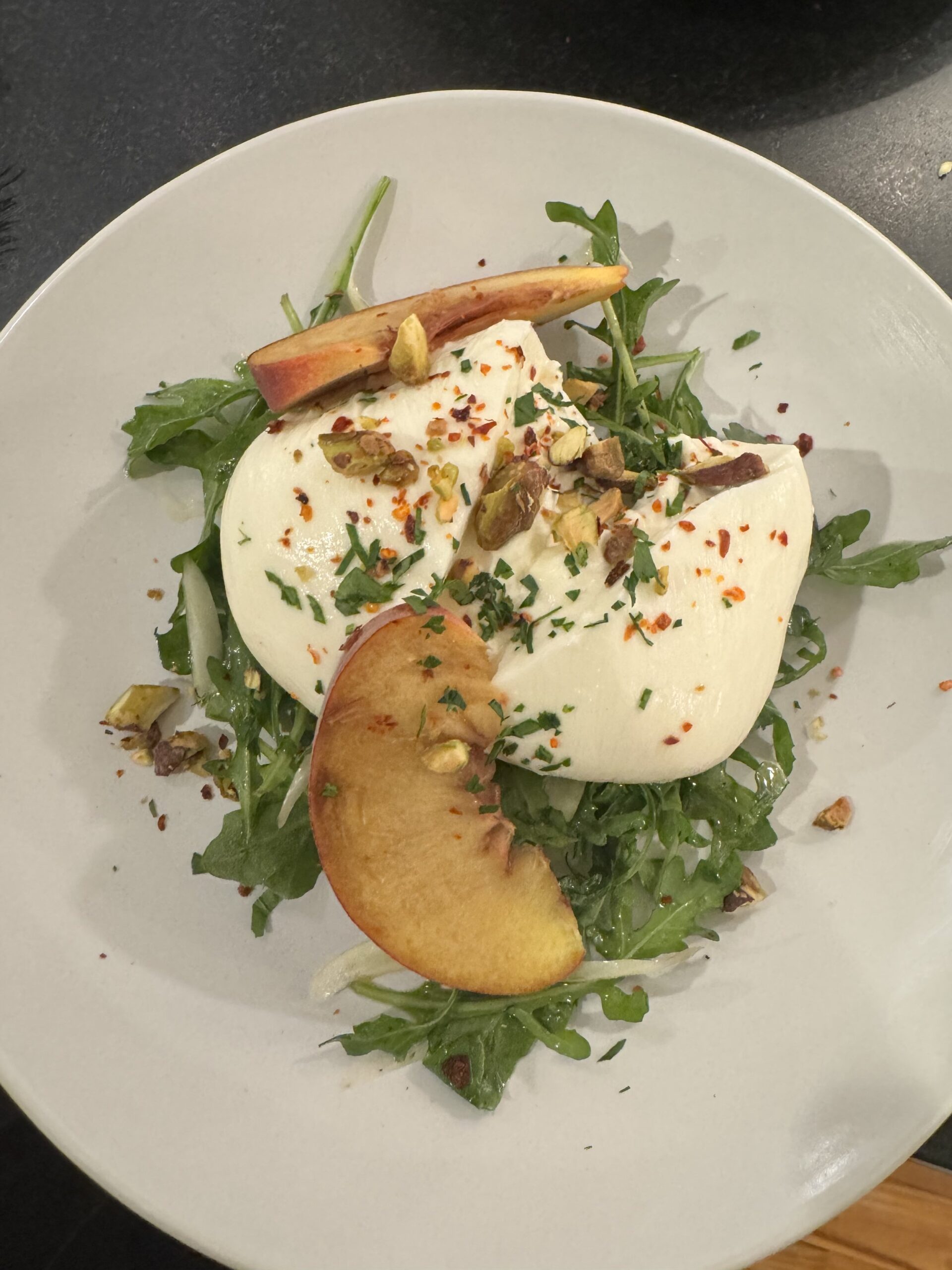 arugula, peach, burrata,  pistachios